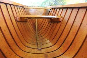 View of stern seat and transom from inside the hull. Dark block on the right is backing for the anchor pulley.